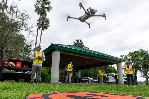 Embry-Riddle student Nicholas Buckalew launches a Skydio UAV for a research project to survey plant life on Lake Beresford in DeLand, Florida
