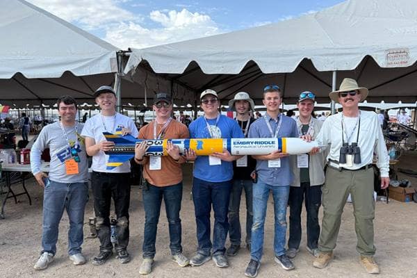 Team members from Embry-Riddle’s Rocket Development Lab at the International Rocket Engineering Competition (IREC) in Midland, Texas. Holding the team’s rocket (from left to right) are: alumnus Bryce Chanes (’18); students Quentin Trull, Shea Schmidt, Chase Ahrens, Kevin Wise, Ben Lambertson, Calvin Lindemann; and Professor Mark Benton, the team’s faculty advisor.