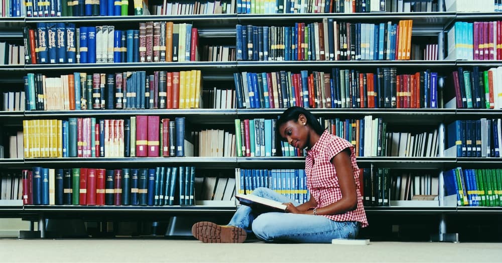 student reading in a library