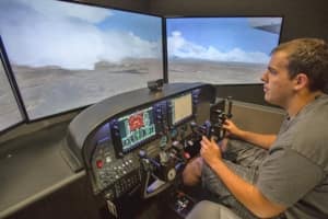 A student tests his skills in a Paradigm Diamond DA42NG AATD flight simulator at Embry-Riddle's Prescott campus