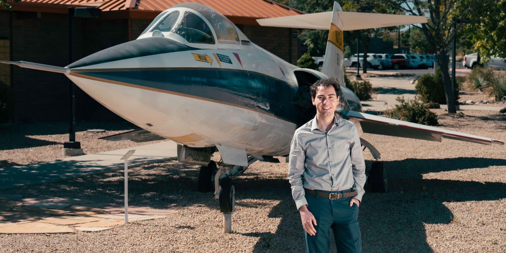 Adam Moore standing in front of the Lockheed F-104N "Starfighter" on Embry-Riddle's Prescott Campus. (Photo: Embry-Riddle / Connor McShane)
