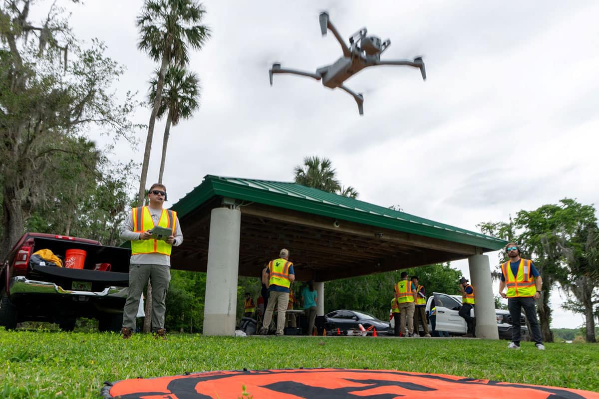 Embry-Riddle student Nicholas Buckalew launches a Skydio UAV for a research project to survey plant life on Lake Beresford in DeLand, Florida