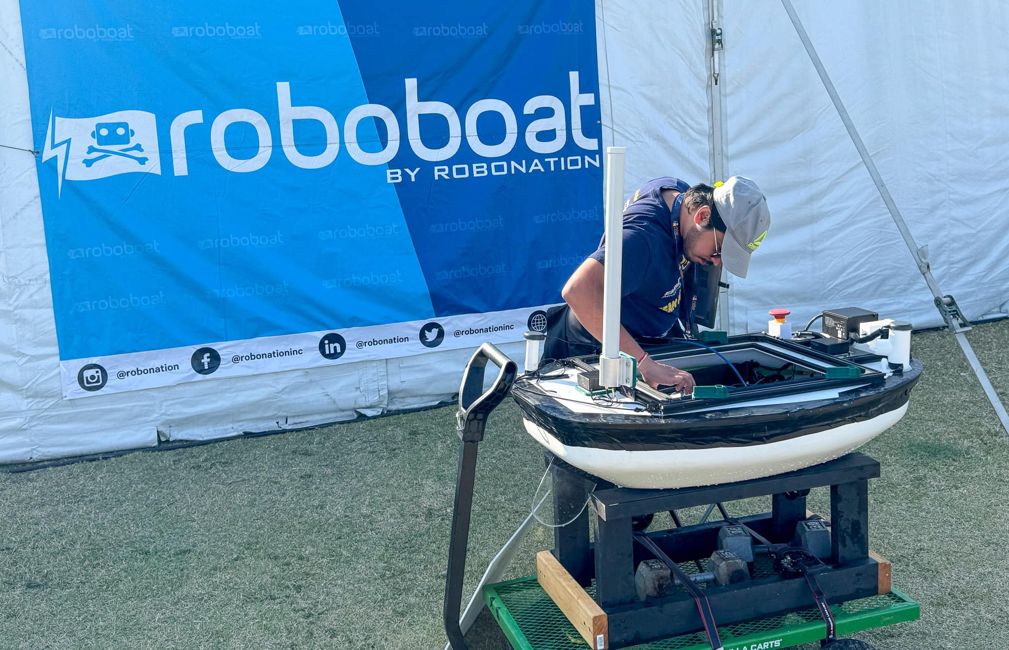 Sagar Sarkar, a Ph.D. student studying Mechanical Engineering, tinkers with MiniMinion, which was built by Embry-Riddle students to compete at the 2025 RoboBoat competition in Sarasota, Florida. 