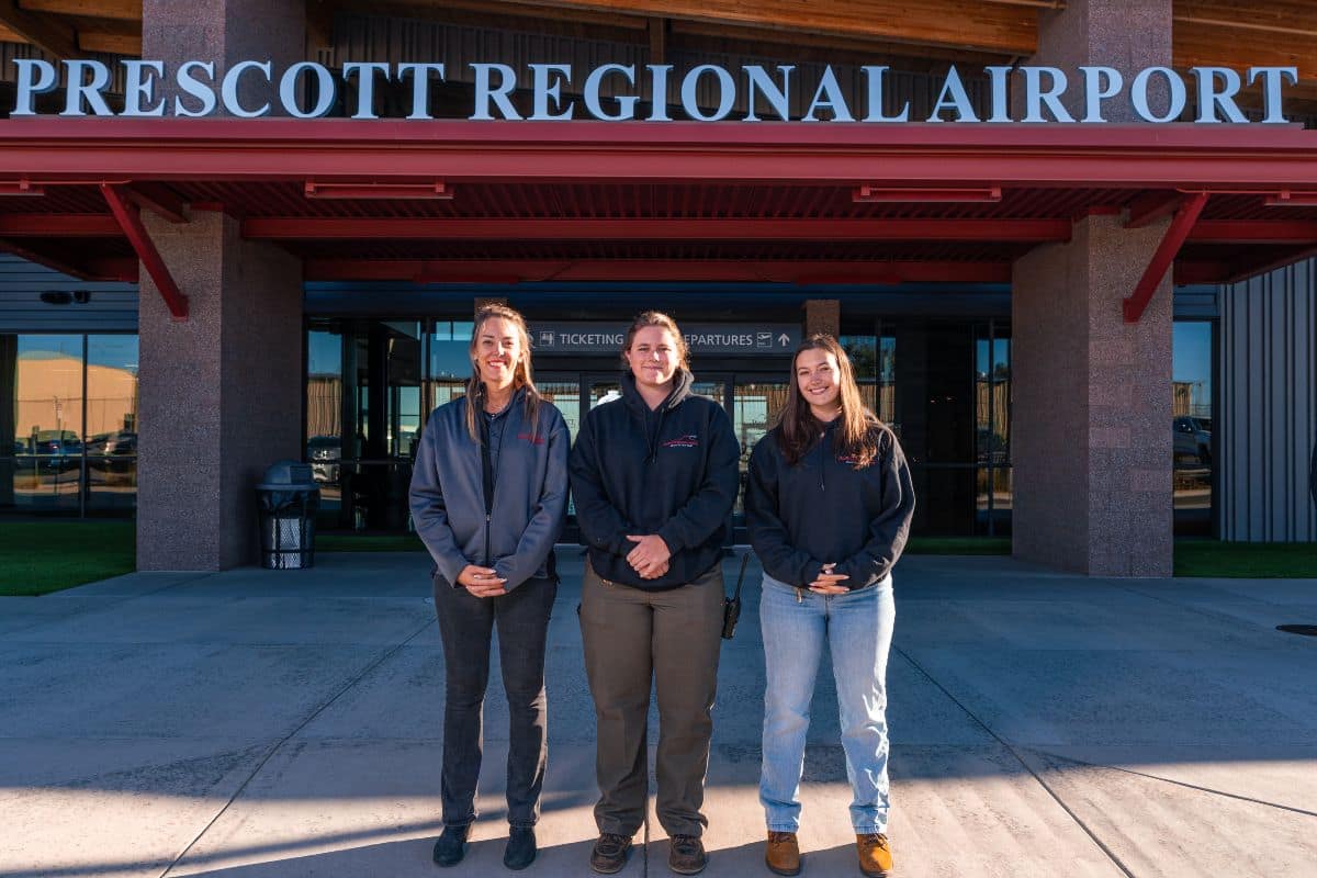 Embry-Riddle alumni (from left) Julia Metivier (’20), Sydney Webb (’25) and Dakota Bernier (’25) are bridging the gap between classroom and workplace in their roles at Prescott’s airport, Ernest A. Love Field.