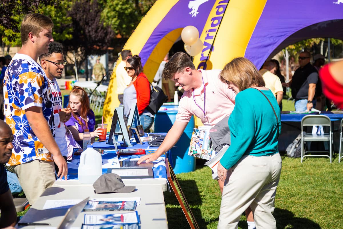 Prospective student looks at a booth during Open House 2018 at Embry-Riddle