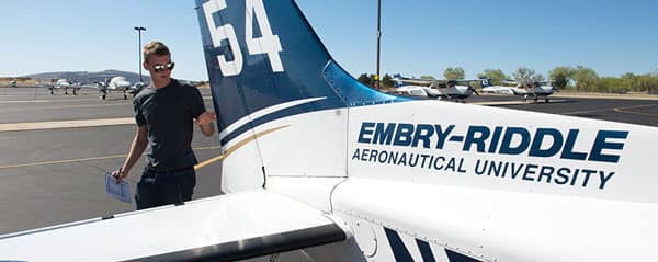 a student checks an airplane
