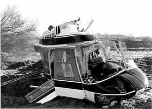 Photograph of the helicopter crash - the cabin is the only part in the photo - no rotor, tail or skids.