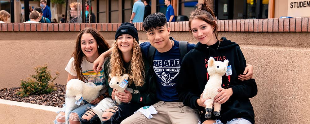Students Holding Plush Animals