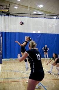 students playing volleyball