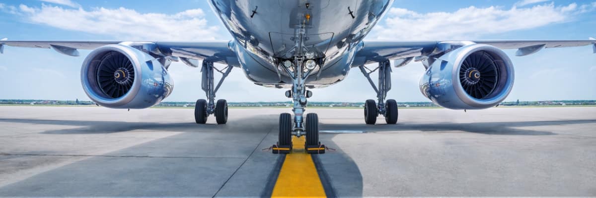 Commercial airliner sitting on a runway.