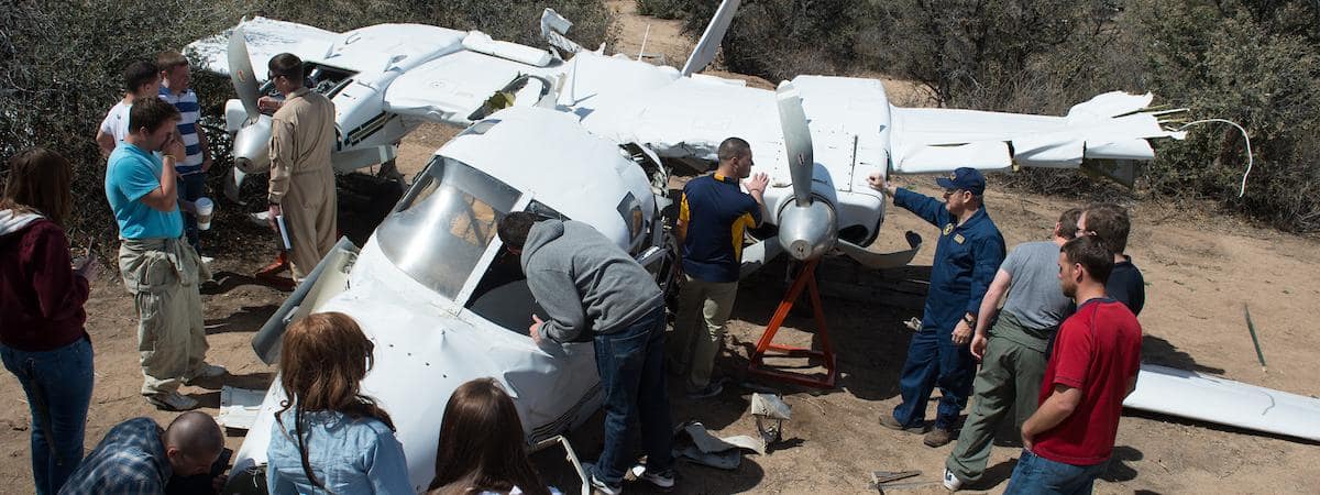 Students investigate the aircraft crash laboratory at Embry-Riddle Aeronautical University's Prescott Campus College of Aviation Department of Safety Science