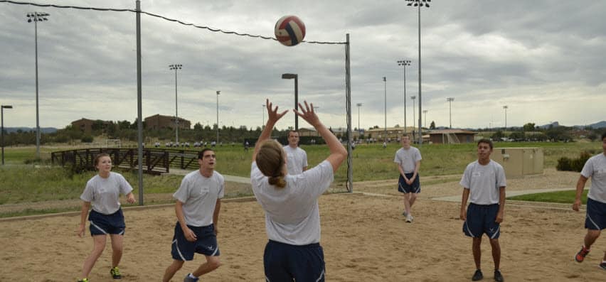 students playing volleyball