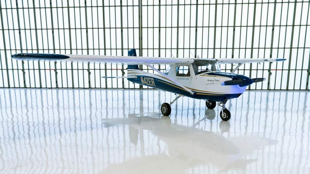 A Cessna 150 aircraft on the Embry-Riddle Prescott Flight Line hangar