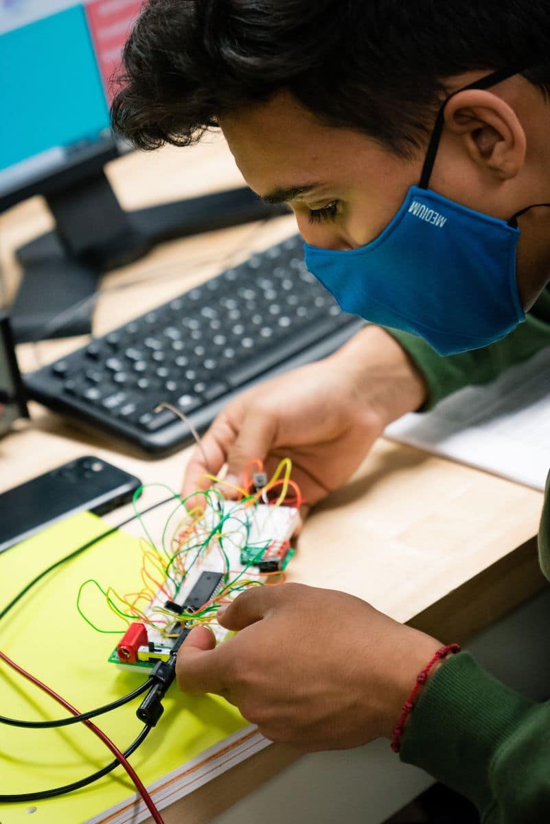 A student learns how to operate equipment in Embry-Riddle's Power Lab